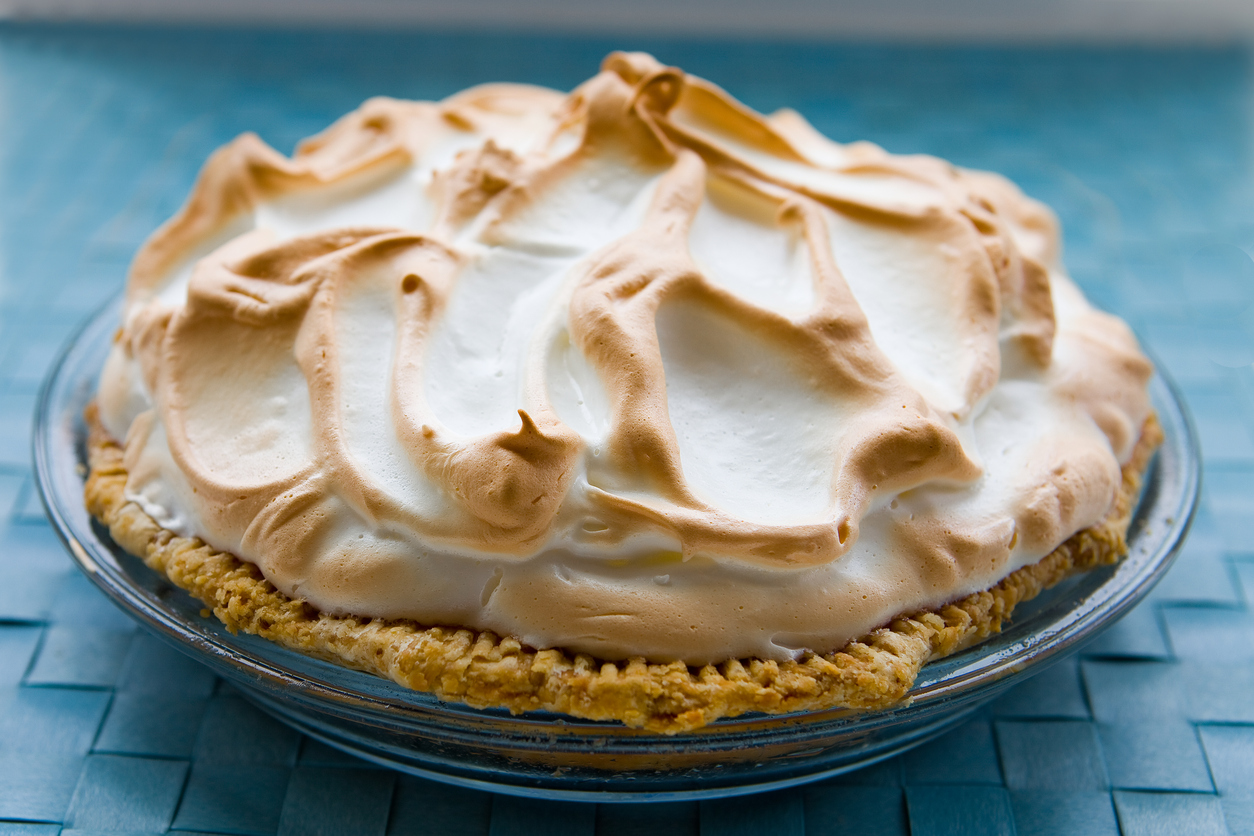 Key lime pie on a blue background.